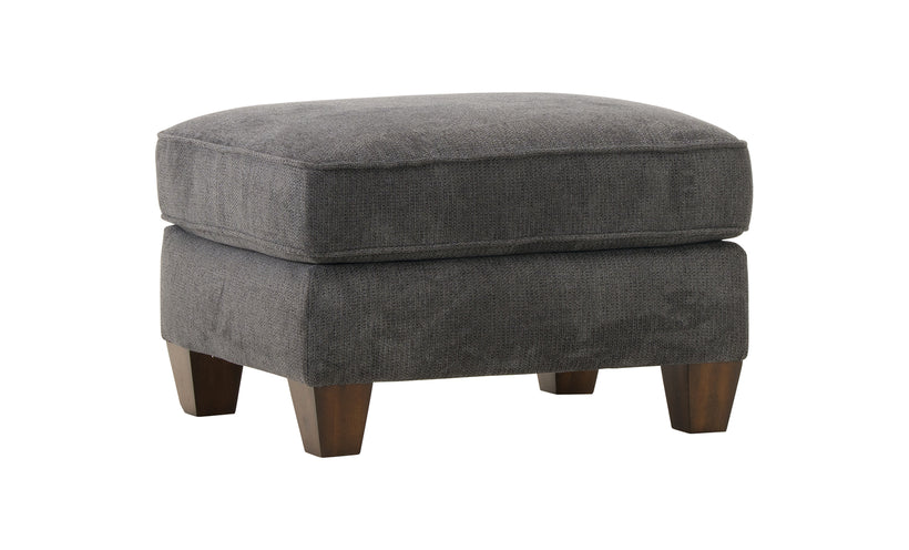 Gray upholstered ottoman with wooden legs on a white background